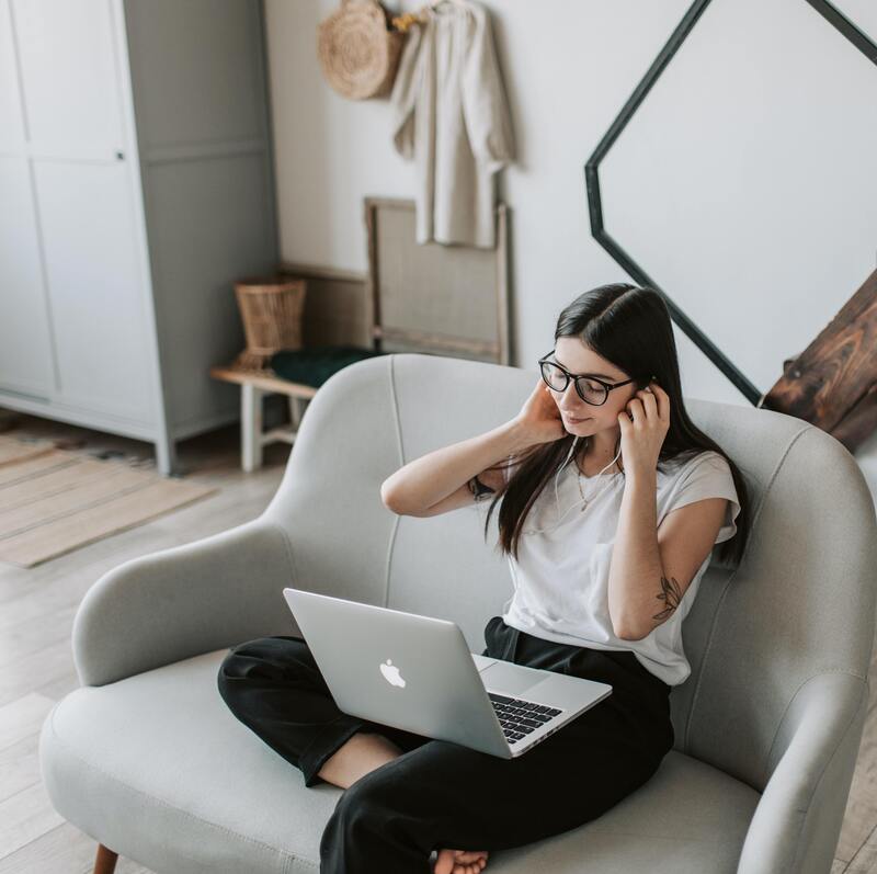 a smartly dressed woman engaged in an online video call.