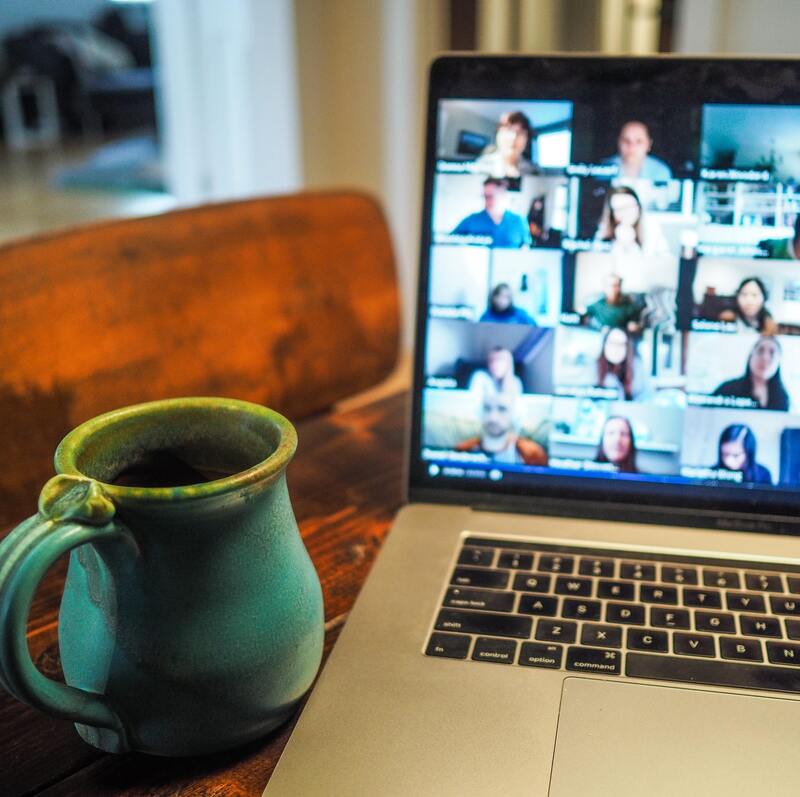 Image of a laptop with a virtual meeting being conducted.